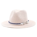 Detail of light pink straw panama hat featuring blue white rope and silver anchor buckle - Pink