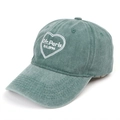 Macro detail of teal green washed cotton cap with heart and Ofr. Paris embroidery - Green