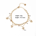Close-up of gold bow pendants with zircon stones on double-layered link chain bracelet - Style 1-Gold Bow