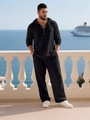 Detail of black men's casual hooded loungewear set showing linen texture and buttons - S / Black