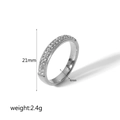 Detailed view of silver stainless steel ring featuring three rows of pave-set cubic zirconia - Size 8 / Silver