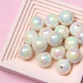 Detailed view of colorful iridescent acrylic round beads for DIY jewelry making - Off White