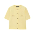 Detail of pale yellow short-sleeve knit cardigan with golden relief buttons on white background - Yellow