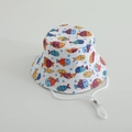 Close-up of children's cotton bucket hat with colorful fish print and adjustable chin strap - White Clownfish