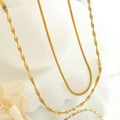 Close-up of golden dual-layer snake and water wave chain necklaces in titanium steel - Gold Snake Chain + Encrypted Water Wave Chain