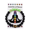 Colorful chakra lava stone meditation bracelet with OM bead on white display card - Turquoise
