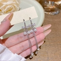 Silver bow and pearl long tassel earrings held by hand for a luxury aesthetic style - E0194 Silver Needle (Exquisite Bow Pearl Tassel Silver White)