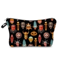 Close-up of portable toiletry bag featuring colorful African mask patterns on black canvas - Black African Mask
