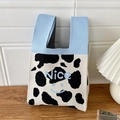 Blue and cow print knit bucket bag with Nice text and smiley face on wooden surface - Cow Pattern