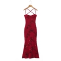 Detail view of red fishtail dress featuring 3D floral embroidery and lace-up back - Red