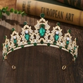 Detail of golden baroque crown featuring emerald green crystals and teardrop rhinestones - Gold with Green Zircon