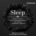 Detail of handmade obsidian chip bracelet with sleep-aid benefits on a black mirror surface - Obsidian