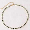 Detail of gold tennis necklace with alternating green and white cubic zirconia stones - Green Necklace-Gold
