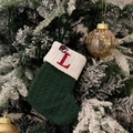 Green knit Christmas stocking with white cuff and red embroidered letter L - Green/Letter L