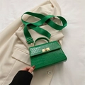 Green faux crocodile embossed crossbody bag with wide strap and golden twist lock - Green