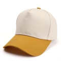 Detail view of reinforced stitching on curved brim and mustard yellow contrast panel - Adjustable / Beige/Ginger Yellow