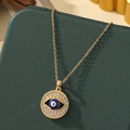 Collier en acier titane doré avec pendentif œil maléfique et accents de cristal bleu - A11-Gold