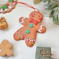 Gingerbread man Christmas ornament with red bow and glitter on vintage book pages - Bowtie Gingerbread Man 10*8cm