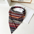 Flat lay detail of a bohemian cotton triangle headscarf with geometric patterns - Black Ethnic Pattern