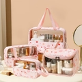 4-piece set of transparent makeup bags with pink floral and butterfly prints - Small, Medium, Large And Flip Top Bag Set / Pink Butterfly & Flower