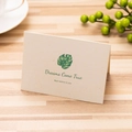 Folded monstera leaf greeting card with Dreams Come True text on textured beige paper - Dreams Come True / Single Card