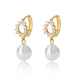 Detail of gold teardrop pearl earrings with cubic zirconia pave on a white reflective base - Gold Pave Zirconia Ring with Teardrop Pearl