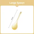 Detail view of a 22.5cm long beige ceramic spoon with a hanging hole on the handle - 22.5cm Large Spoon / Cream