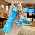 Porte-clés ours liquide en cristal bleu avec sangle silicone et charme de glace - Ours Sable Mouvant - Glace Bleue / Bleu
