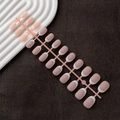 Row of oval French gradient press-on nails in nude pink and white on a display stand - French White Tip Oval Matte (DMC-01MS)