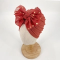Infant turban hat in brick red ribbed knit featuring a gold polka dot mesh bow - Wine Red