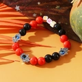 Beaded bracelet with red and black spheres, silver Hamsa charms, and BOO letter beads - Halloween BOO Letters Red Black Cross