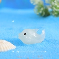 Luminous resin dolphin figurine in blue glitter finish measuring 1.6cm by 2.6cm - Milky White