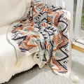 Bohemian knit throw blanket with navajo geometric patterns and fringe on white sofa - Ukulele Pattern / 80*120CM