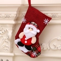 Classic red fabric Christmas stocking with a 3D Santa Claus applique hanging on a mantel - Linen Medium Stocking (Santa Style)