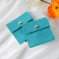 Microfiber jewelry pouch in tiffany blue with gold snap button on silk background - Microfiber Snap Button Style / 8*8cm / Light Cyan