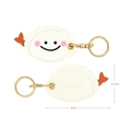 Porte-clés en cuir en forme de ravioli avec visage souriant et détail de queue orange - Ravioli aux crevettes
