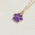 Golden necklace featuring a vibrant purple enamel cat paw print charm with minimalist chain - Purple