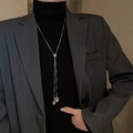 Detail of adjustable silver tassel sweater necklace with hollow spherical metal pendants - Hollow Spherical Tassel Style (16#)