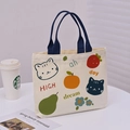 Beige canvas tote bag with dark blue handles featuring cute cartoon cat and fruit motifs - Orange Cat