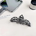 Gothic spider hair claw clip in gunmetal finish with hollow metal spider legs detail - Black