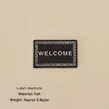 Miniature felt Welcome sign for Christmas dollhouse decor with white text and wavy edges - No.113 - Black WELCOME Felt Mat
