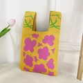 Knitted tote bag in vibrant yellow with pink floral patterns and a wide handle - Floral Leaf Yellow