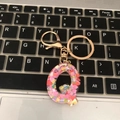 Letter Q keychain with colorful heart sequins in transparent resin and gold ring - Letter Q