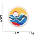 Macro detail of a 8.8cm round embroidered patch with ocean waves and sun design - No. 7 (Landscape Sunset Round)