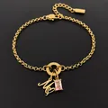 14K gold plated stainless steel bracelet featuring letter M and pink gemstone pendant - Letter M