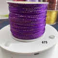 Macro detail of dark purple cord with metallic gold thread on white spool No. 675 - Medium Purple With Gold Thread (675)