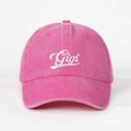 Detailed close-up of Gigi embroidery on peach pink washed denim baseball cap with air vents - Adjustable / Rose Red
