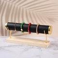Detail of jewelry display stand with black leather bar, gold metal and wooden base - 1-Tier Black Leather