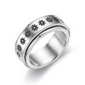 Macro view of stainless steel spinner ring with etched black daisy floral patterns - Size 6 / Daisy Pattern / Silver
