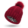 Close-up of burgundy knit hat with soft satin lining and matching faux fur pompom - Burgundy
